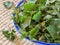 Freshly cut nettles in a bowl.