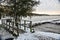 Freshly Fallen Snow on Walkway Bridge and Docks on a Lake