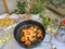 Freshly fried scampi with salad, white bread and a glass of white wine.