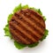 Freshly grilled plant based burger patty on bun with lettuce isolated on white. Top view