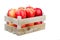 Freshly harvested apples in a wooden crate