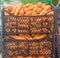 Freshly harvested carrots in boxes prepared for sale. Growing eco-friendly products in farm. Agriculture and farming. Seasonal