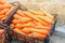 Freshly harvested carrots in boxes prepared for sale. Growing eco-friendly products in farm. Agriculture and farming. Seasonal