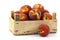 Freshly harvested peaches in a wooden crate