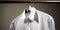 A freshly ironed shirt hangs crisply on a hanger its smooth fabric devoid of any wrinkles or creases, concept of