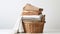 Freshly laundered clothes stacked in a wicker basket on a white background. AI Generated