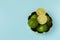 Freshly lime fruits on trendy light blue background