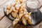 Freshly made Angel Wings Cookies with powdered sugar close-up. horizontal