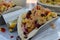 Freshly made fish tacos with corn relish on tray at restaurant
