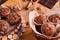 Freshly made muffins in a basket with walnuts, almonds, dark chocolat e. there is a fork nearby