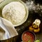 Freshly made pizza dough rising in a bowl