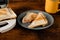 Freshly made toasted sandwiches from a sandwich maker on a plate on a wooden rustic background. Toasted triangular sandwiches with