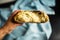 Freshly made yeast bread on a light blue cloth