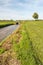 Freshly mown grassland bordering on a ditch