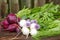 Freshly picked beets, turnips, herbs and leafy greens on an old