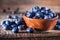 Freshly picked blueberries in a bowl. Fresh and healthy juicy blueberries on a rustic background. Blueberries as a  antioxidantt.