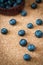 Freshly picked blueberries in woven natural screw pine leaf bowl.