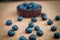 Freshly picked blueberries in woven natural screw pine leaf bowl.