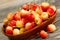 Freshly Picked Golden Rainier Cherries in Basket on Rustic Wood