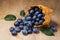 Freshly picked ripe blueberries are scattered on a wooden table. Harvest berries.