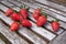 Freshly picked strawberries against a wooden surface
