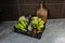 Freshly picked vegetables in a plastic crate, on the kitchen table. Fresh vegetables grown in the garden. Different types of