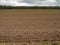 Freshly ploughed brown farming land.