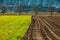 Freshly plowed spring field for planting vegetable seeds