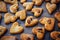 Freshly puff dough heart shaped cookies, top view close up. St Valentine`s Day concept. Abstract bakery background with copy space