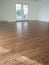 Freshly refinished red oak hardwood flooring, stained medium brown and 3 coats of bona HD satin