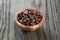 Freshly roasted arabica coffee beans in bowl