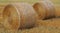 Freshly rolled hay bales in a field in Tuscany Italy. Golden and relaxing contest. Summer season