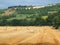 Freshly rolled hay bales in a field in Tuscany Italy. Golden and relaxing contest. Summer season