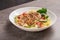 Freshly seasoned cajun chicken Fettuccine pasta in a creamy sauce on white plate. American cuisine.