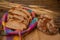 Freshly sliced bread with a bread knife in a basket on a jute fabric