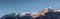 freshly snow-covered mountain peaks of the hahnenkamm mountain range in winter with a blue, cloudless sky near reutte