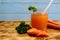 Freshly squeezed glass of healthy carrot juice from a fresh crop