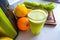 Freshly squeezed green juice in a glass on the table.