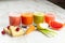 Freshly squeezed juices in glasses on a wooden table