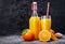 Freshly squeezed orange juice in glass bottle