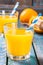 Freshly squeezed orange juice in a glass with straws