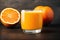 Freshly squeezed orange juice in a glass on wooden table, closeup. Healthy food concept. Generative AI