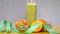 Freshly squeezed orange and kiwi fruit  juice in a glass on a table stock video stock footage