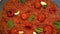 Freshly Tomato paste texture close-up with bazil and pepper