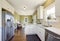 Freshly updated white and green kitchen room interior