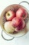 Freshly washed apples in a colander