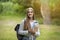 Freshman Girl. Beautiful Female College Student With Workbooks And Backpack Posing Outdoors