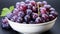 Freshness and ripeness in a bowl of purple grapes generated by AI