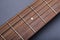 Fretboard on Acoustic Guitar Close-Up on Fifth Fret