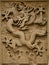 Fretwork in the form of a dragon on the wall in the Forbidden City. Beijing,